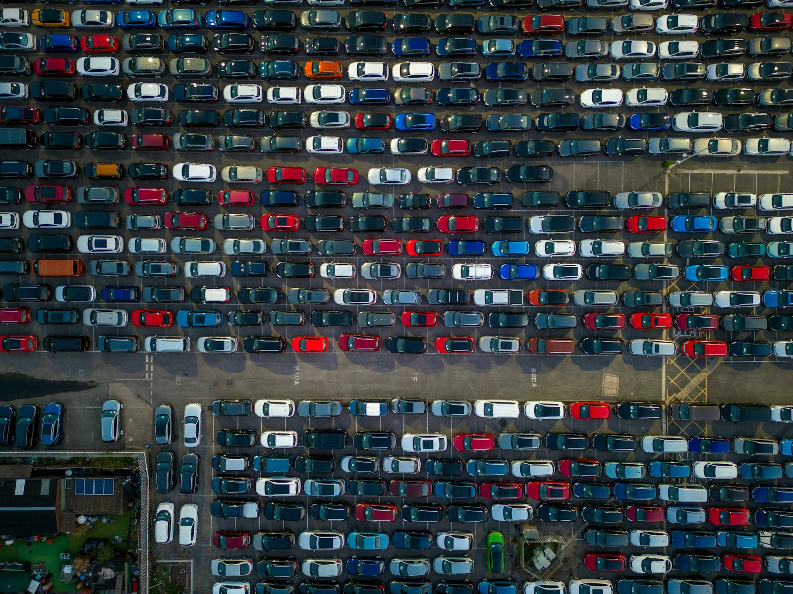 Car being loaded into a shipping container at port