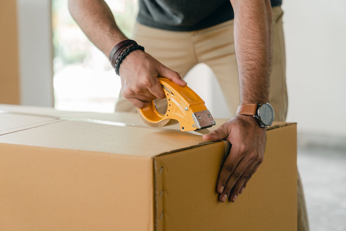 Family's household goods and personal belongings being loaded into a shipping container for overseas relocation